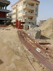 a building under construction in front of a building at التطبيقيين راس البر in Ras El Bar