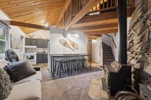 a kitchen and living room with a fireplace in a house at Nordic Nook in Whitefish