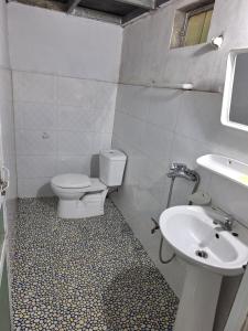 a bathroom with a toilet and a sink at Beautiful Homestay Sapa in Sapa +85 photos