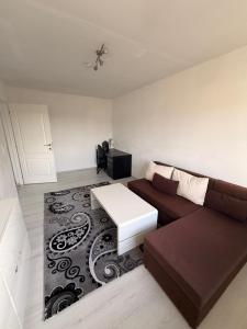 a living room with a couch and a table at Kleines Appartment mit großer Terrasse in Herscheid