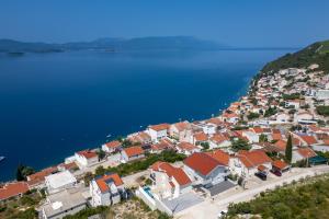 an aerial view of a town on a hill next to the water at Villa Sole in Komarna