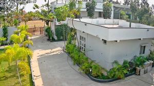 an overhead view of a building with a lot of plants at Ambience Retreat in Malavalli