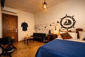 a bedroom with a bed with a sign on the wall at Residenza Cunto in Castellabate