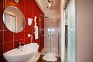 a bathroom with a white sink and a shower at Residenza Cunto in Castellabate +32 photos
