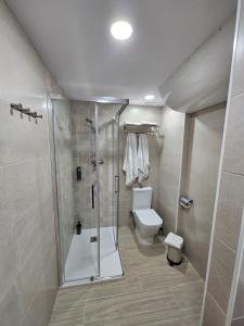 a bathroom with a shower and a toilet at Mataró Center Studio in Mataró +19 photos