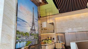 a mural of the eiffel tower on a wall in a restaurant at XING LUN KLCC Platinum Suites in Kuala Lumpur