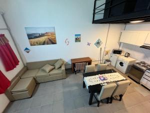 a living room with a couch and a table at Loft Neuquén in Neuquén