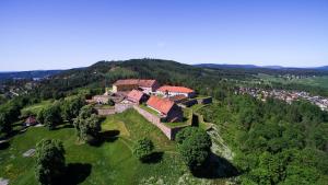 an aerial view of a house on a hill at Kongsvinger Castle Hotel & Resort in Kongsvinger +31 photos