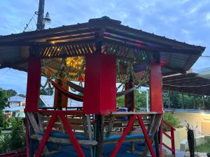 a wooden play structure with a roof at Yogi-Homestay in Koror