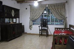 a room with a bedroom with a bed and a window at Alalá Campo in Pocito