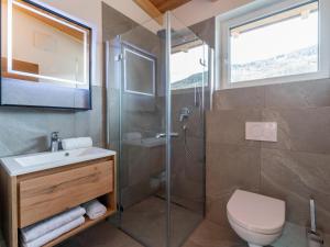a bathroom with a shower and a toilet and a sink at Bergzicht 2A in Sankt Lorenzen ob Murau +45 photos