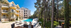 an exterior view of a villa with a swimming pool at Apartments with swimming pool Jadranovo, Crikvenica - 3238 in Jadranovo