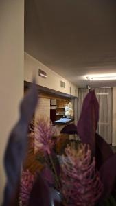 a blurry picture of a room with purple flowers at HOTEL HMR RHO Milano in Rho