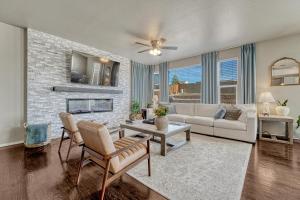 a living room with a couch and a fireplace at Selah Springs Lodge in Colorado Springs