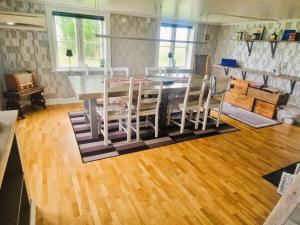 a kitchen with a dining room table and chairs at 4 star holiday home in ÖDESHÖG in Ödeshög