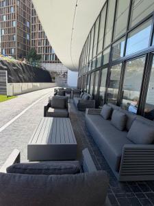 a row of couches sitting outside of a building at Departamento Prestigio 97 in Guadalajara