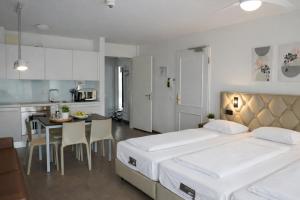 เตียงในห้องที่ Bayer's Boardinghouse und Hotel +97 ภาพ