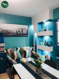a living room with a couch and a table at JHS Condo in Davao City