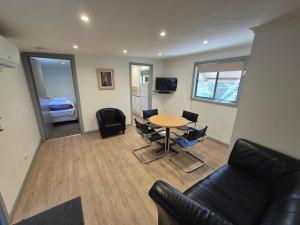 a living room with a table and a couch at Otways Tourist Park in Gellibrand