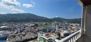 a view of a city from a balcony at PATONG TOWER Residence Apartments 2026 in Patong Beach +61 photos