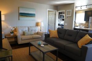 a living room with a couch and a table at East Side Beach House in Santa Cruz +35 photos