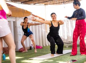 a group of women in a yoga class at Pointbreak Surf Camp in Huanchaco