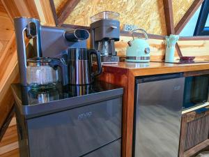 a kitchen with a coffee maker on a counter at Domo La Gloria Tolantongo in Cardonal
