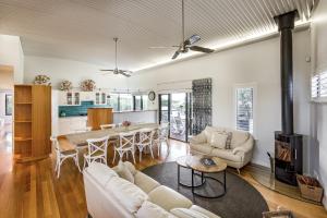 a living room with a couch and a table at Ocean Blue - Gnarabup NEW in Gnarabup