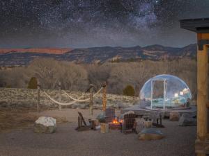a starry night with a igloo and a table and chairs at Brycegate Retreat. Stunning Views. Modern Comforts. in Hatch