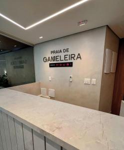a wall with a sign that readsarma de camera fega at Flat Luxo em Boa Viagem - 5min do Aeroporto - perto da praia - Wi-Fi 500mb - check-in 24h in Recife +14 photos