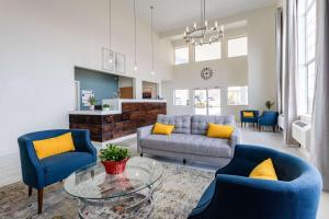 a living room with a couch and chairs and a table at Quality Inn Winslow I-40 in Winslow