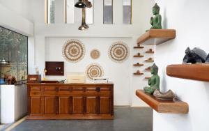 an office with a desk and shelves on the wall at Stay Siem Reap in Siem Reap