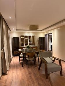 a dining room with a table and chairs at Modern 4BR 3Bath Stylish Spacious in Madinaty