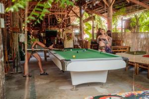 a group of people playing a game of pool at Wonderland in Siquijor +40 photos
