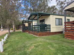 a mobile home with a gazebo in a yard at Bonnie Doon Caravan Park in Bonnie Doon