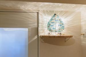 a christmas tree on a shelf next to a door at Minato Marine Stay in Nagoya +39 photos