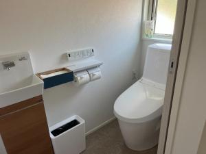 a small bathroom with a toilet and a sink at Yuimaru - Vacation STAY 43049v in Bora