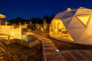 a large tent in a yard at night at MGBACE - Vacation STAY 19466 in Kubo