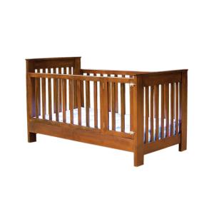 a wooden crib with a wooden rail at Adi Residences - Private Apartments and Villa Stay Batticaloa in Batticaloa