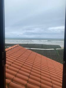 a view of the ocean from the roof of a building at Cabana Maktub in Uruçuca