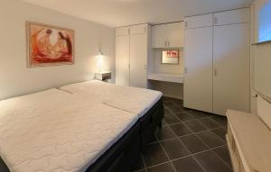 a bedroom with a large white bed in a room at Nice Home In Ansager With Wifi in Ansager