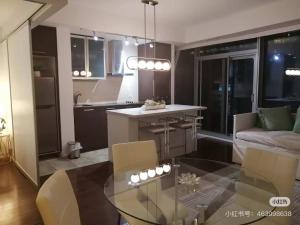 a kitchen and living room with a glass table at Pine Breeze in Markham
