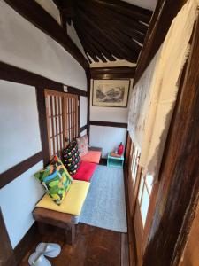 an overhead view of a living room with a couch at Hundred Years Hanok in Mokpo