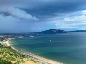 a view of a beach and the ocean at Apec Mandala Imperial Ocean Tower Mui Ne in Mui Ne