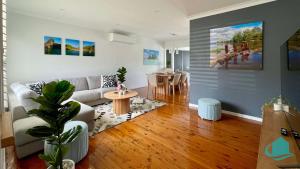 a living room with a couch and a table at Casa Calvi - Central location with Pool in Jewells Station