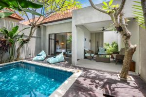 a pool in the backyard of a villa at Le Cielo Resort Canggu Batu Bolong by Maviba in Canggu