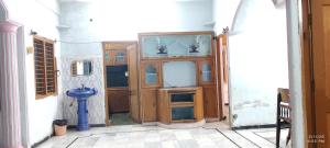 a bathroom with a toilet in a room at Kurnool Homestay in Kurnool
