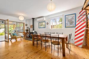 a dining room with a table and chairs at Pet Friendly Island Garden Retreat in Cowes in Cowes