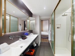 
a bathroom with a sink, toilet, and bathtub at H10 Casa Mimosa 4* Sup in Barcelona
