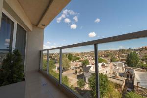 a view of a city from the balcony of a house at Edificio Guttero in Caleta Olivia